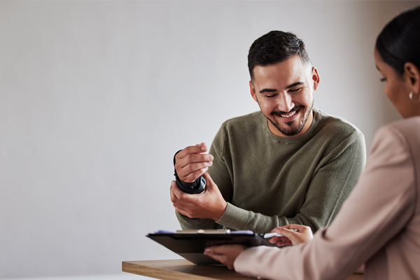 Person meeting with a benefits advisor to review insurance options.